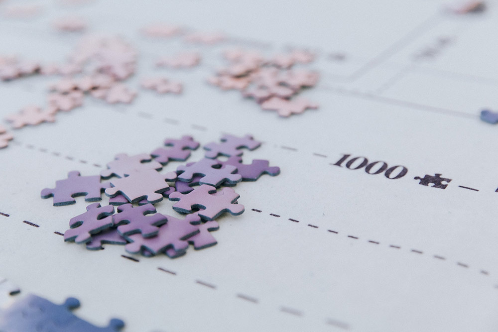Jigsaw pieces photo by Bianca Ackermann on Unsplash